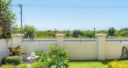 Downstairs beach unit opposite Airforce Beach with pool, BBQ deck, linen included, and easy access t