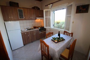 Alex Montos apartment Karousades kitchen and dining area