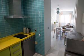 Fridge, microwave, stovetop, coffee/tea maker