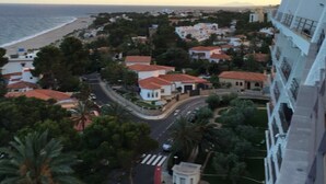 A coastal town with a beach, residential buildings, and a road with vehicles. - PENTHOUSE PANORAMIC VIEWS (Montroig)