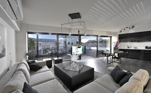 Luxury Loft | Living area | Flat-screen TV