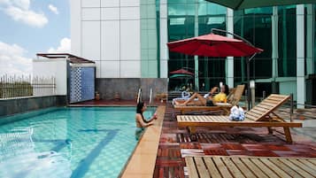Indoor pool, open 7:00 AM to 7:00 PM, pool umbrellas, pool loungers