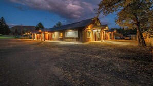 A rustic wooden building with a sign reading "FORTRESS HOTEL & RESORT." - Your Basecamp to Glacier• Cozy 2BR w/ King + Queen (Coram)