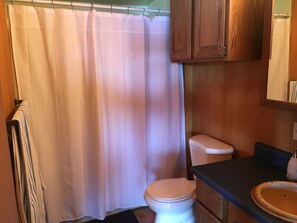 Combined shower/bathtub, hair dryer, towels, soap