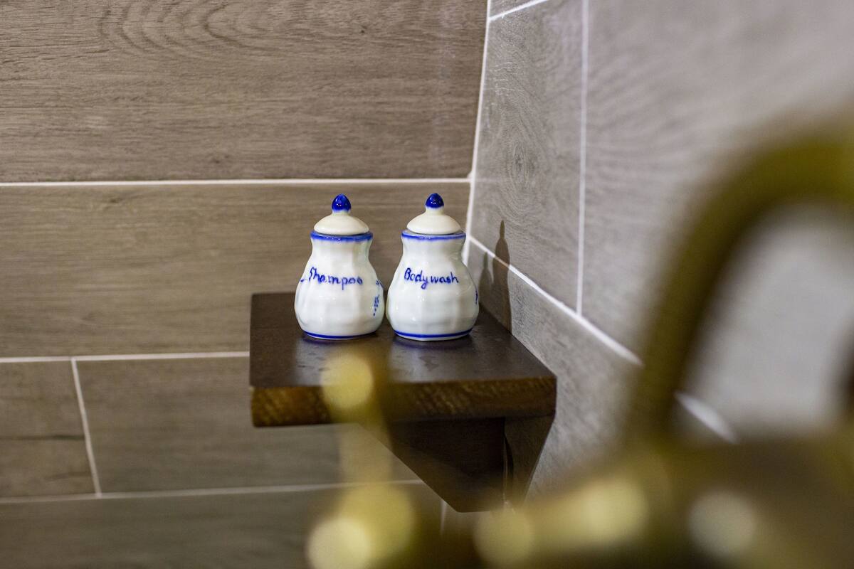 king room, pool view | bathroom amenities | free toiletries, hair dryer, bathrobes, slippers