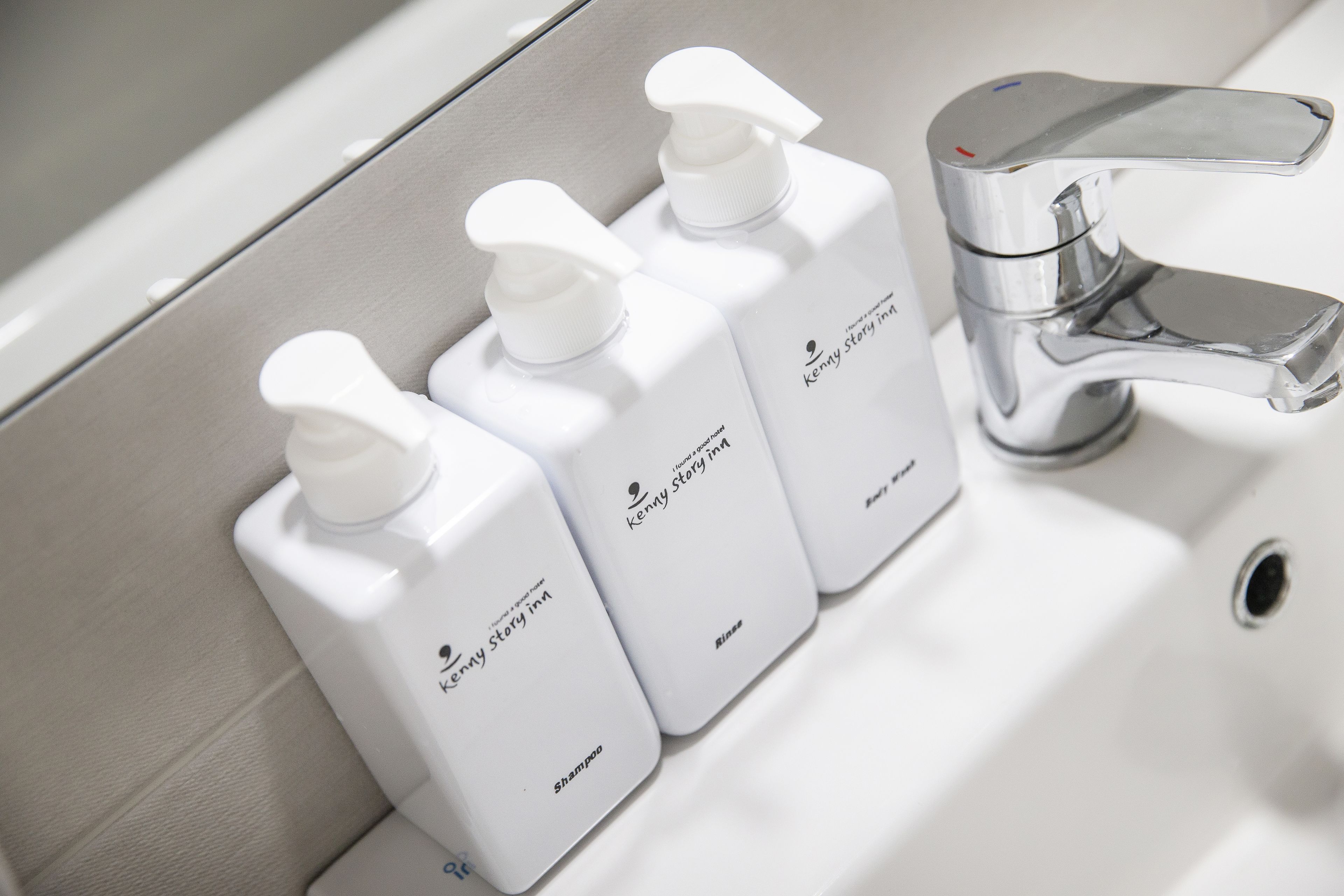 shower, hair dryer, slippers, towels