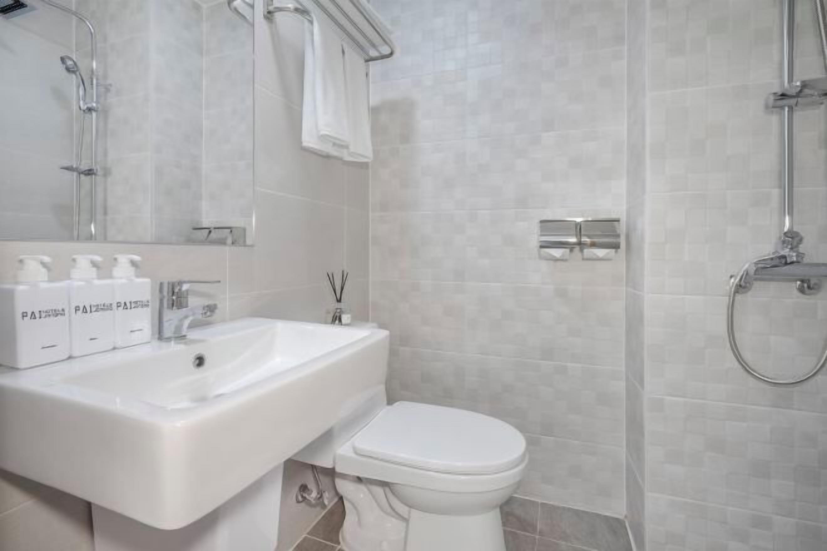 Bathroom | Shower, hair dryer, slippers, towels