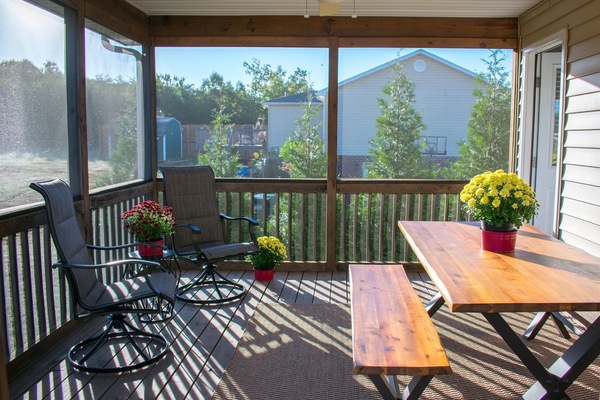 Spacious screened porch off kitchen upstairs
