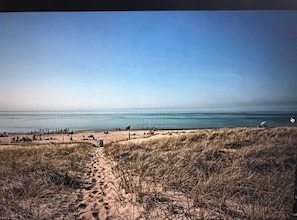 On the beach, sun loungers, beach towels