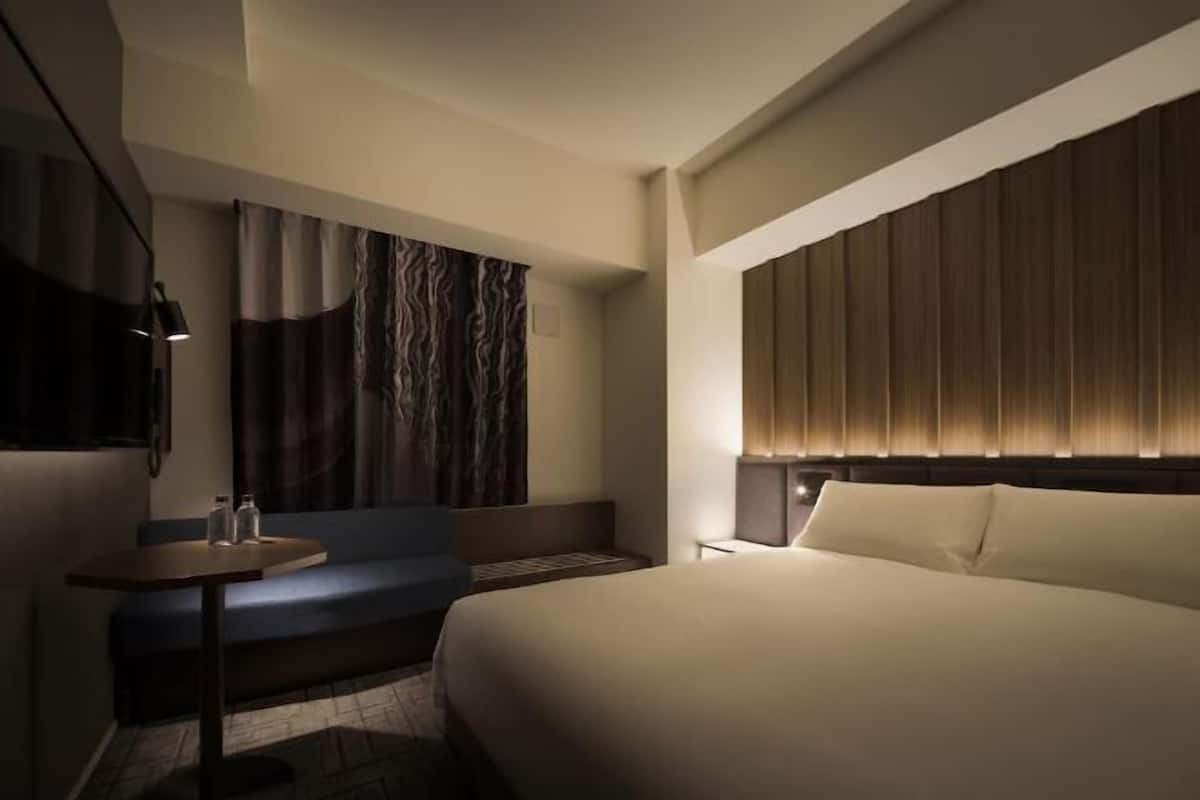 Down duvets, pillow-top beds, in-room safe, desk