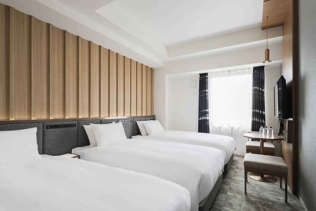 Down duvets, pillow-top beds, in-room safe, desk