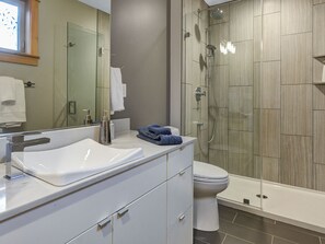 Shower, hair dryer, heated floors, towels