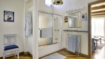 Combined shower/tub, hair dryer, towels, soap