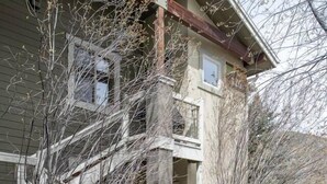 A two-story building with a brick pathway leading to the entrance. - Luxurious, affordable condo one mile from downtown (Ketchum)