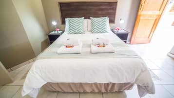 Deluxe Room, 1 Queen Bed, Non Smoking, Garden View | In-room safe, individually decorated, individually furnished, desk