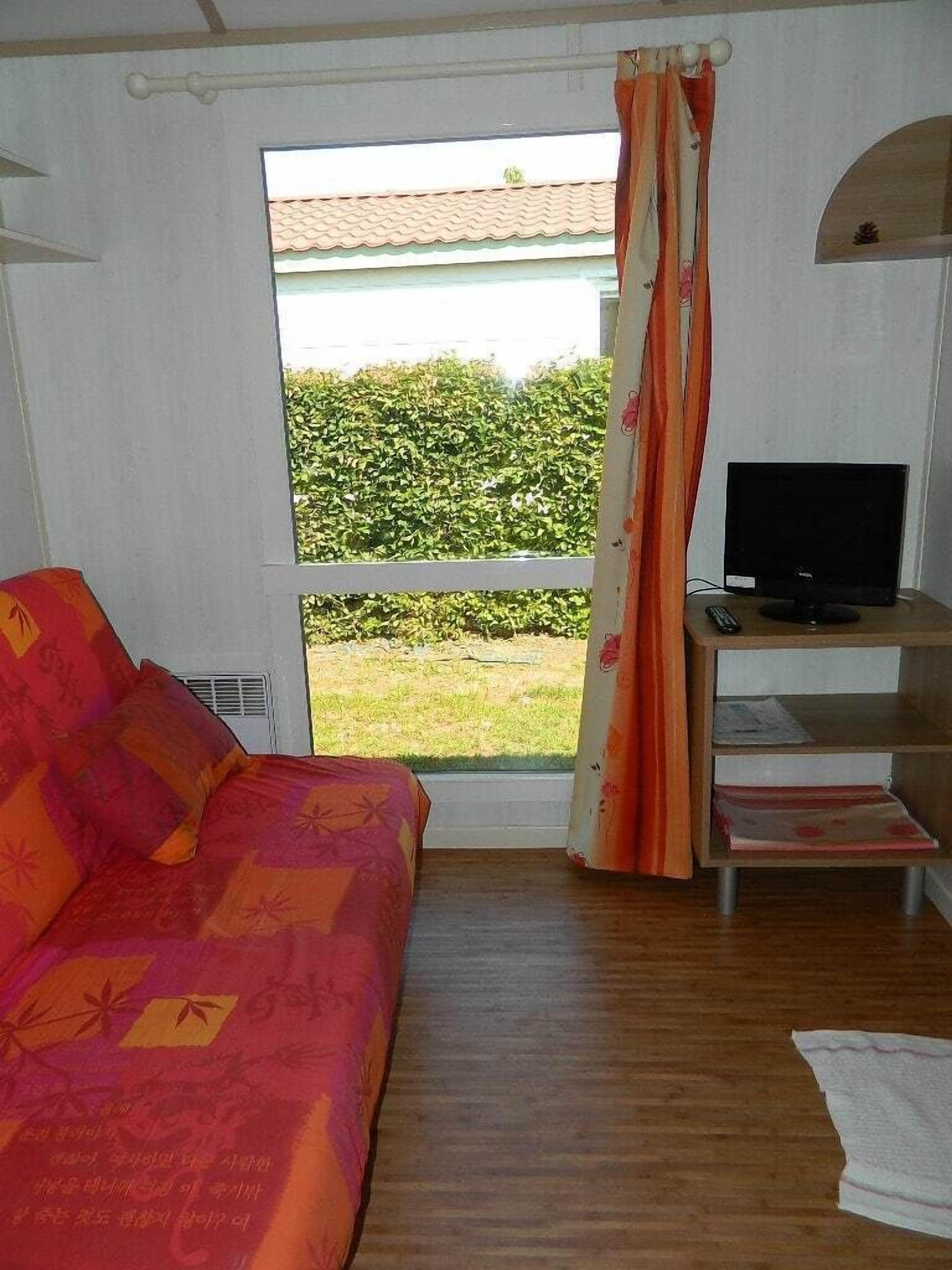 Cottage, 2 Bedrooms | Living area | Flat-screen TV