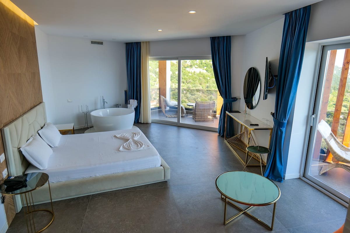 Luxury Suite, Balcony, Sea View | 1 bedroom, in-room safe, iron/ironing board, free WiFi