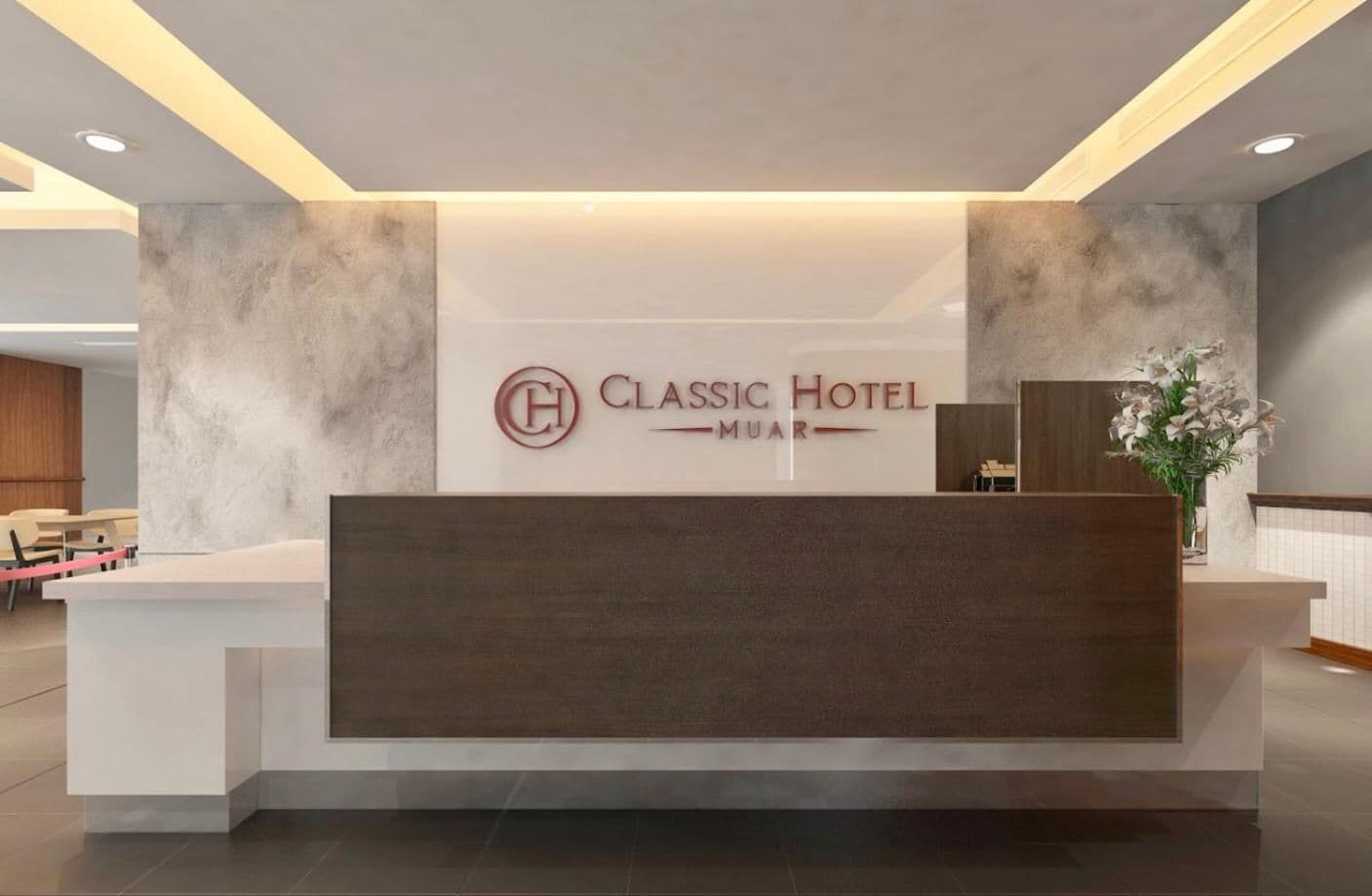 Una recepción en el Hotel Classic Muara con un diseño moderno, un logotipo y una zona de estar al fondo.