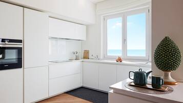 Appartamento Design, 3 camere da letto, vista spiaggia | Cucina privata | Frigorifero con congelatore, microonde, forno, lavastoviglie