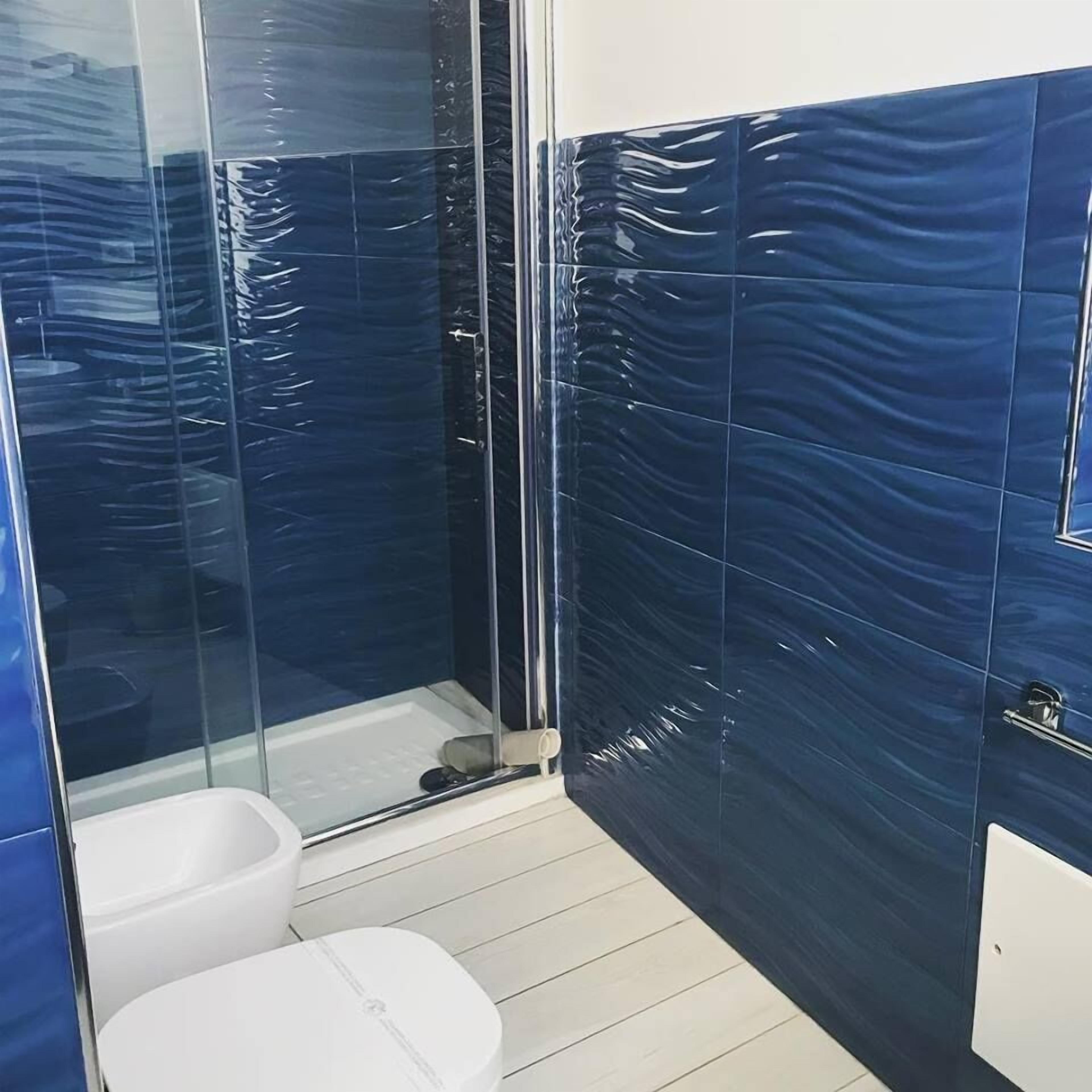 Premium Quadruple Room | Bathroom | Shower, free toiletries, hair dryer, bathrobes