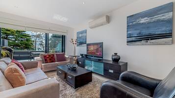 Apartment, 3 Bedrooms | Living area | Flat-screen TV, DVD player