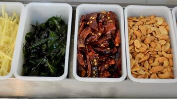 A kitchen with five containers holding different food items.