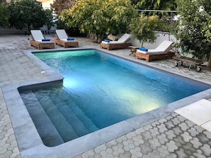 Outdoor pool, pool umbrellas, pool loungers