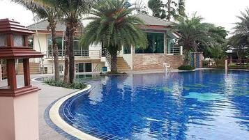 Outdoor pool, open 6:00 AM to 10:00 PM, pool loungers