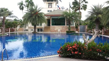 Outdoor pool, open 6:00 AM to 10:00 PM, pool loungers