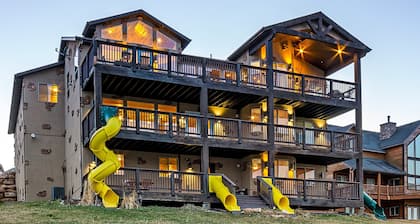 The "Big House" with.. Indoor Basketball, Trampoline and Play set, Theater Room