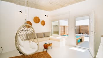 Deluxe Suite, Hot Tub | Living area | 42-inch flat-screen TV with satellite channels, TV