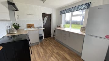 Familienzimmer, Gartenblick | Eigene Küche | Kühlschrank, Mikrowelle, Wasserkocher mit Kaffee-/Teezubehör