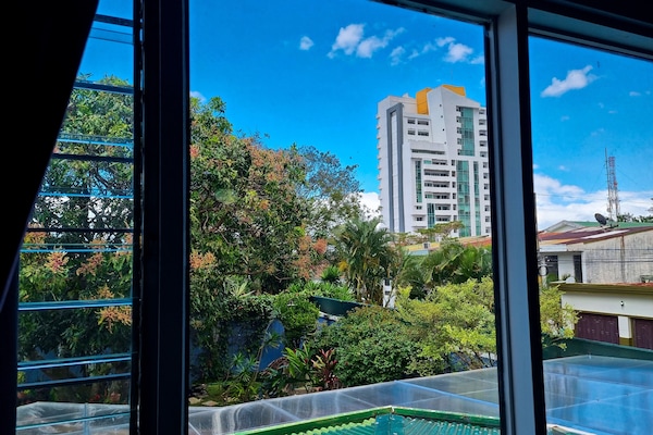 Deluxe Quadruple Room, Private Bathroom, Garden View | Pemandangan taman