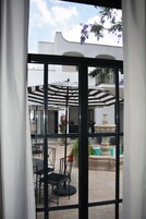 Deluxe Suite, 1 King Bed, Courtyard View | 1 bedroom, Egyptian cotton sheets, premium bedding, in-room safe