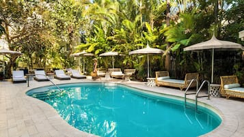 Outdoor pool, open 7:00 AM to 7:00 PM, pool umbrellas, pool loungers
