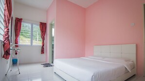 A bedroom with a white bed, pink walls, and a window with curtains. - Cameron Highlands (Cameron Jaya) (Cameron Highlands)