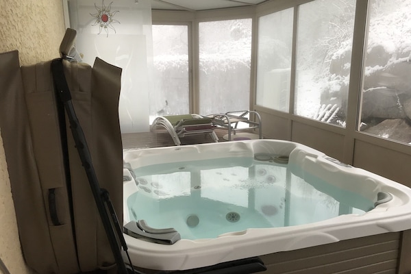 L’espace Jacuzzi extérieur abrité