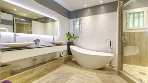 Combined shower/tub, hair dryer, towels, soap