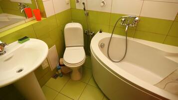 Bathtub, hair dryer, towels, soap