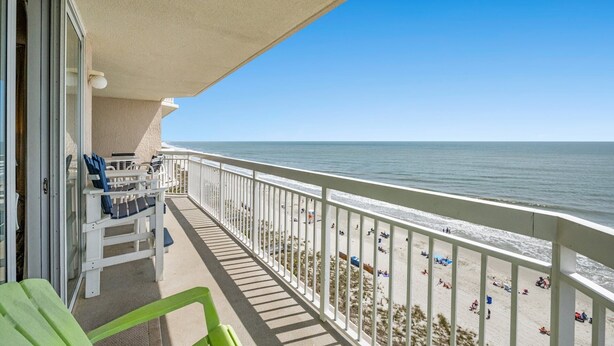 A balcony with a view of the beach and ocean. - Amazing Oceanfront Condo, Indoor and Outdoor Pools | Crescent Shores - S 912 (North Myrtle Beach)