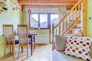 Enjoy a meal in the dining area with a view of the surrounding mountains.