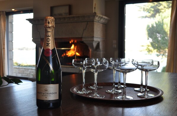 A bottle of Moet & Chandon champagne on a tray with several glasses.