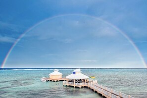 On the beach, sun loungers, beach towels - Grand Cayman, Morritts Grand Penthouse Suite - Panoramic Ocean Front View.  (East End)