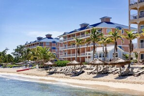 On the beach, sun loungers, beach towels - Grand Cayman, Morritts Grand Penthouse Suite - Panoramic Ocean Front View.  (East End)