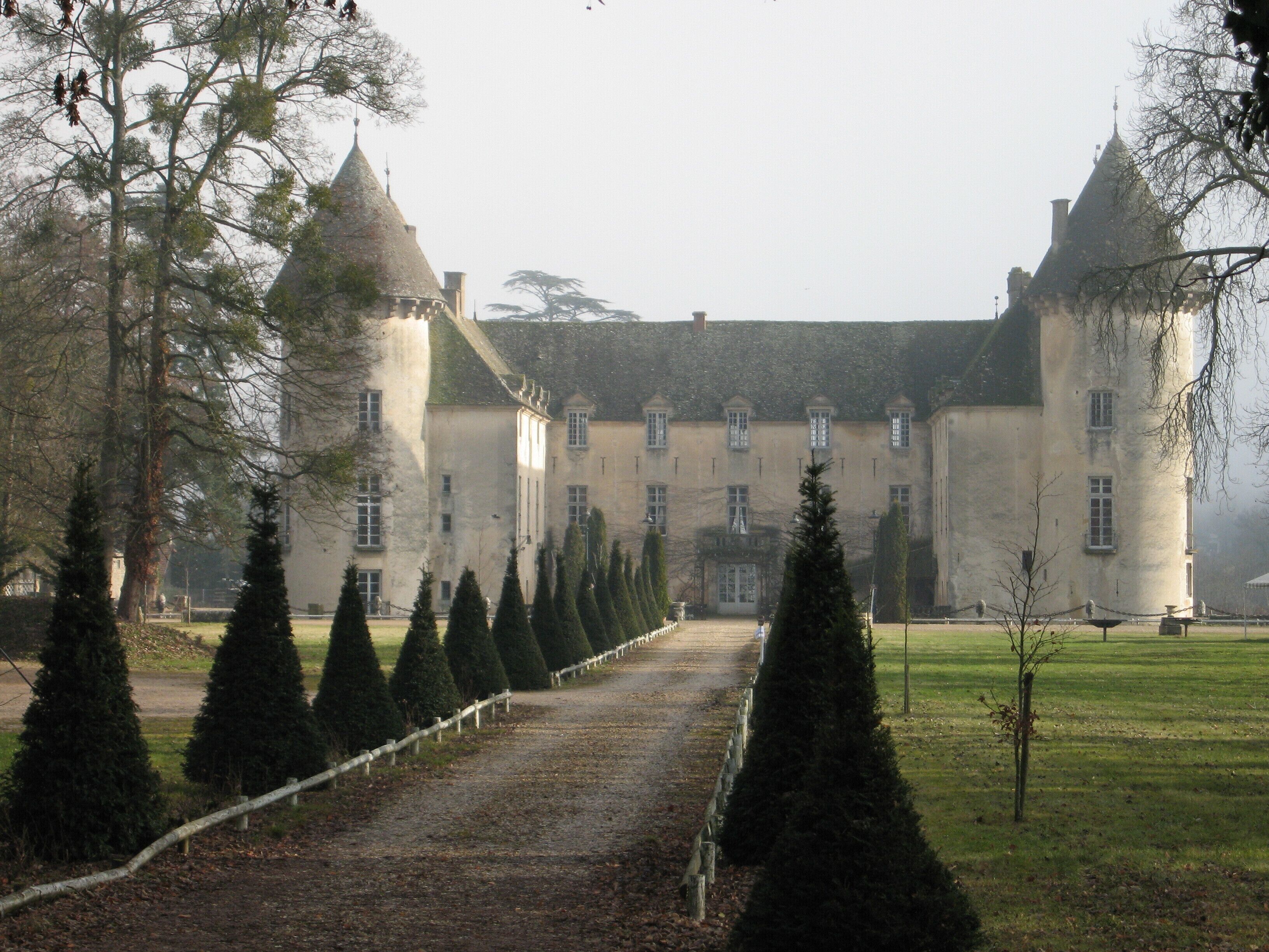 A large, historic building with a symmetrical facade, multiple windows, and a central entrance.