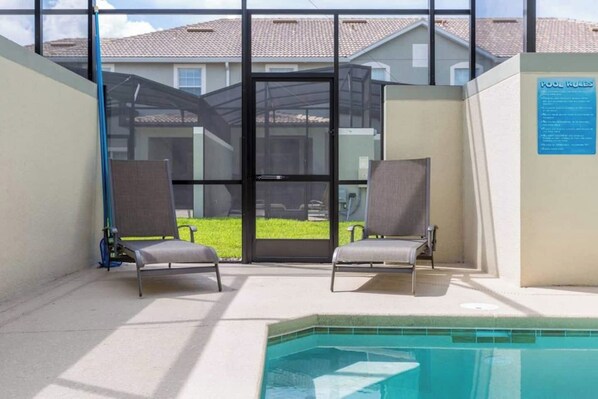 Outdoor pool, a heated pool, pool loungers