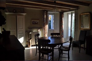 Enjoy meals in this cozy dining area with a round table and comfortable chairs.