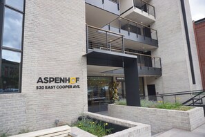 A building with a sign reading 'ASPENHOFF 520 EAST COOPER AVE.' - Location! Location! Location! Outstanding Views of Ajax (203040-6863) (Aspen)