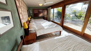 A room with two beds, a ceiling fan, and a large window with a view of greenery. - Tallowood Southwest Rocks - Bring your own linen (South West Rocks)