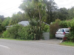 Property grounds - Roa Cottage is a rustic cottage,  close to the start of the Paparoa Great walk. (Blackball)